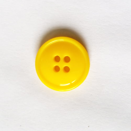 Geel knoopje met een doorsnede van 19 mm